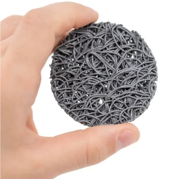Hand holding a round gray EPS bee hive with intertwined textured design