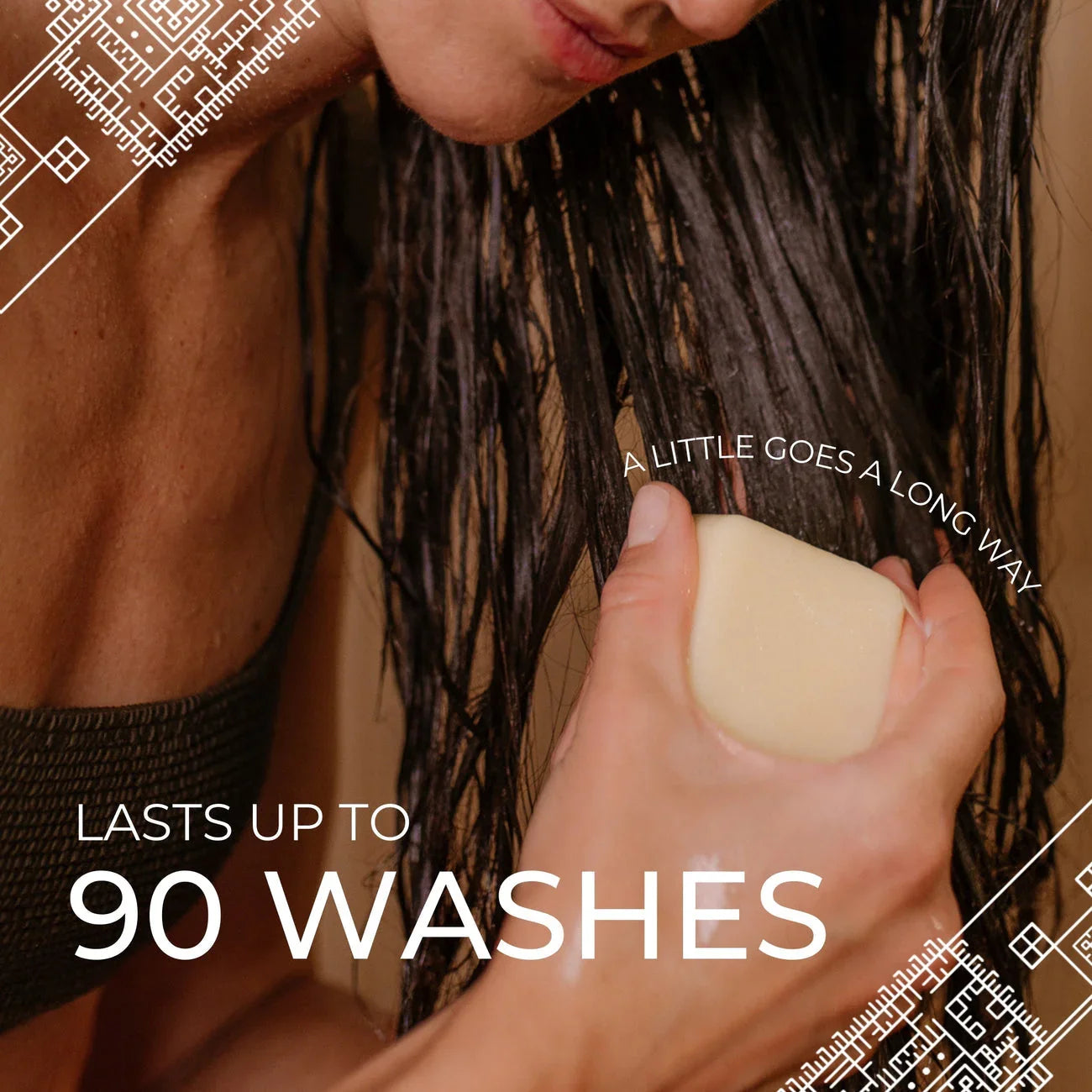 Person applying solid conditioner bar to wet dark hair with text 'Lasts up to 90 washes' and 'A little goes a long way'