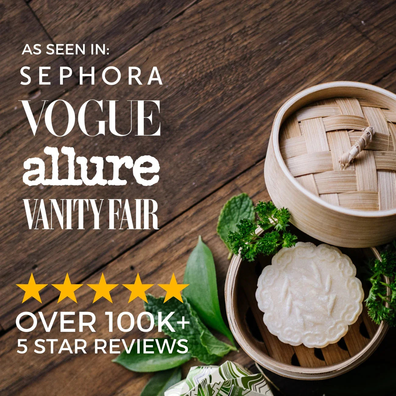 Tea tree shampoo bar with embossed leaf design in a bamboo container surrounded by fresh greenery on wooden surface